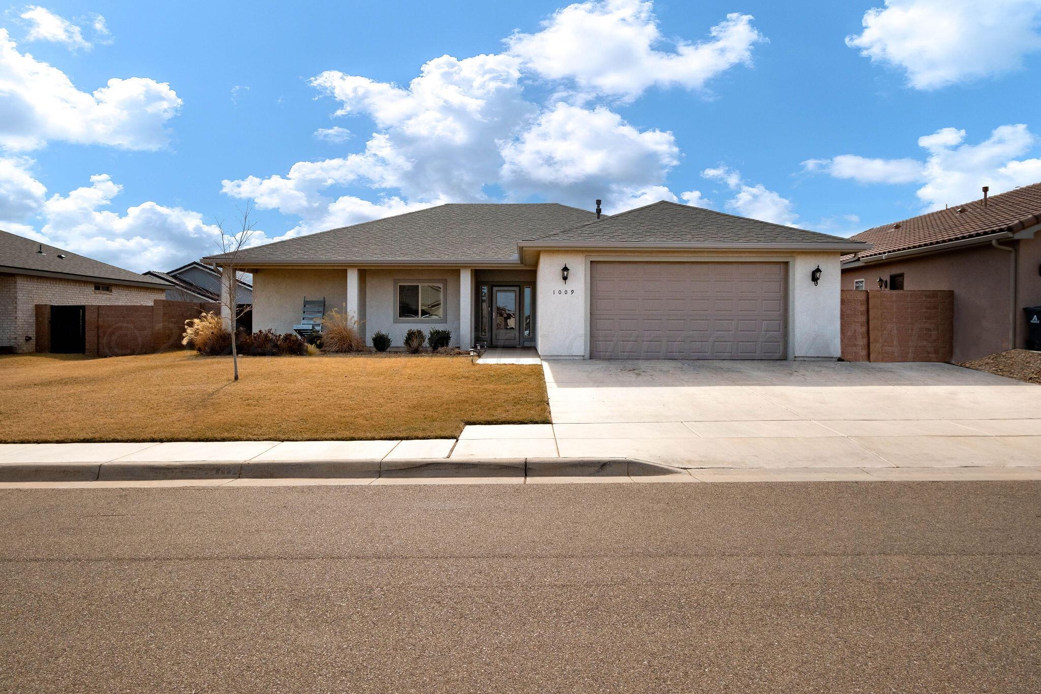 1009 Syrah Boulevard Amarillo, TX 79124 - Photo 1 of 35 a view of a house with a patio