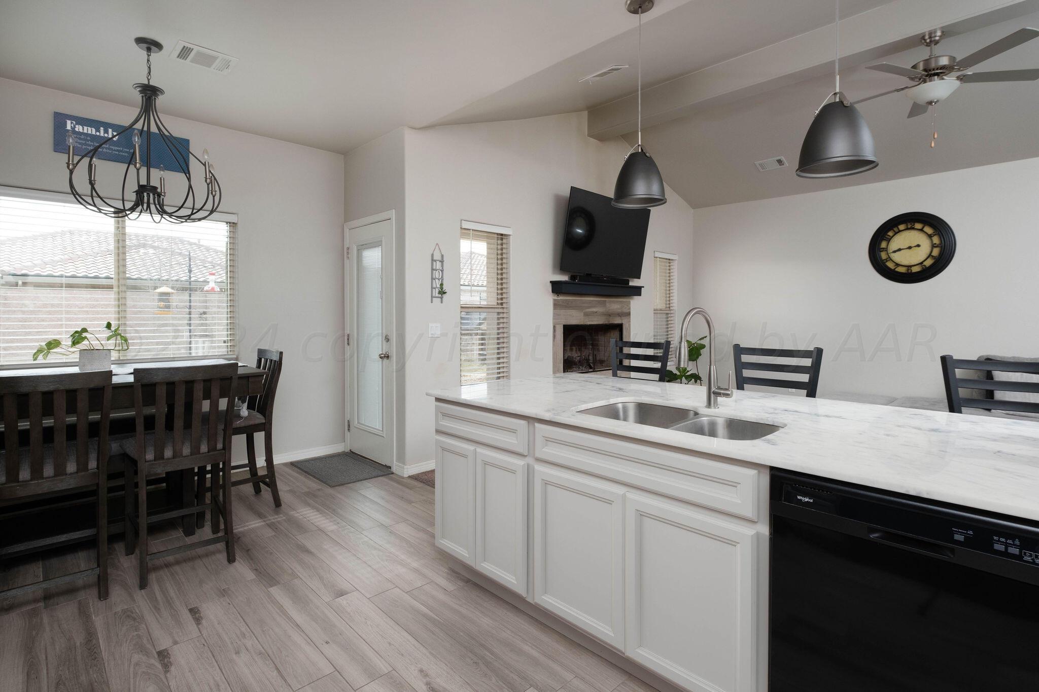 1009 Syrah Boulevard Amarillo, TX 79124 - Photo 13 of 35 a kitchen with a table and chairs in it