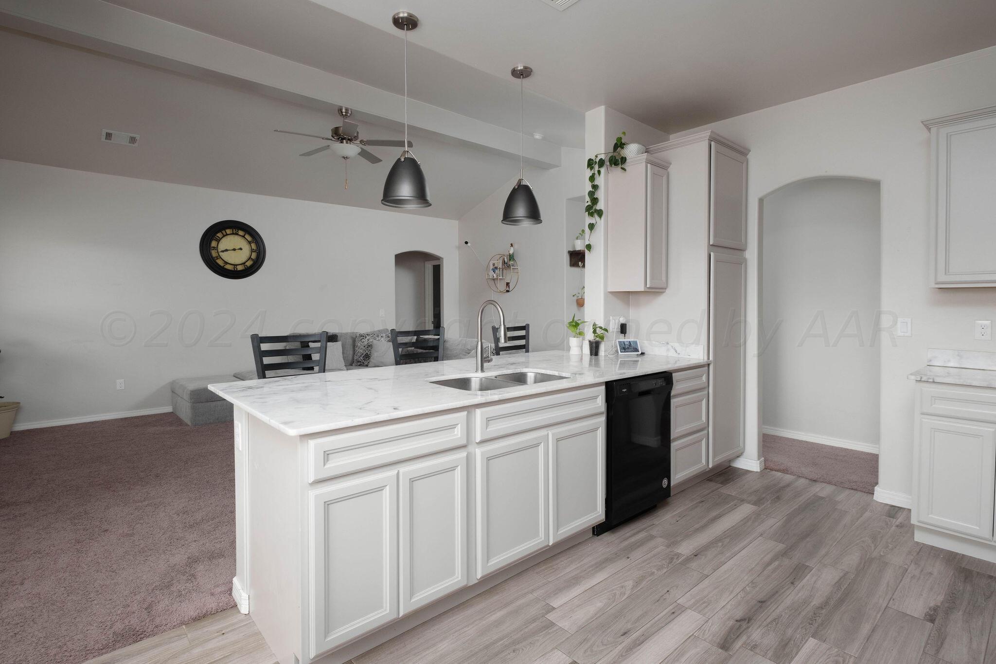1009 Syrah Boulevard Amarillo, TX 79124 - Photo 14 of 35 a spacious bathroom with a double vanity sink mirror and cabinets