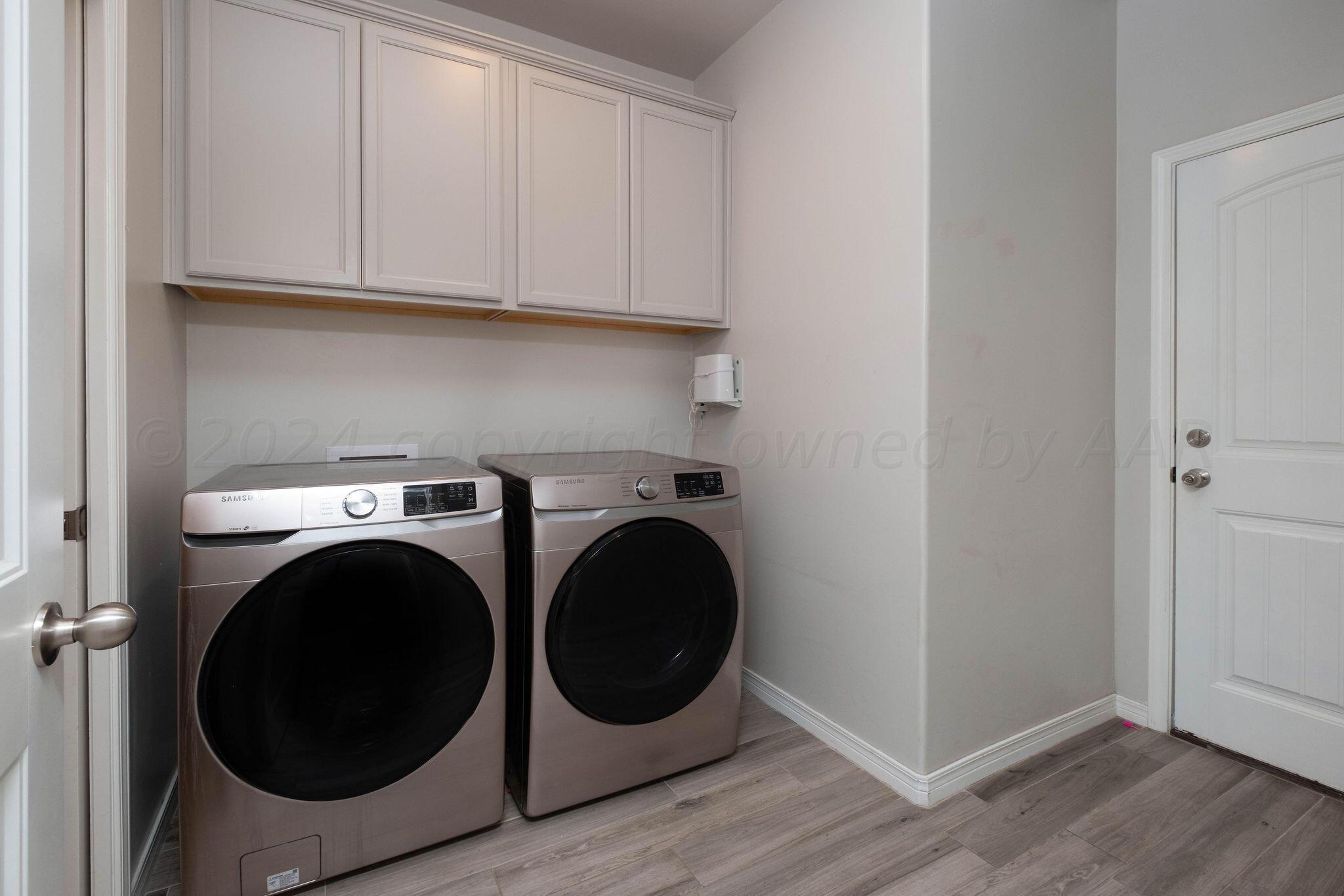 1009 Syrah Boulevard Amarillo, TX 79124 - Photo 30 of 35 a utility room with dryer and washer