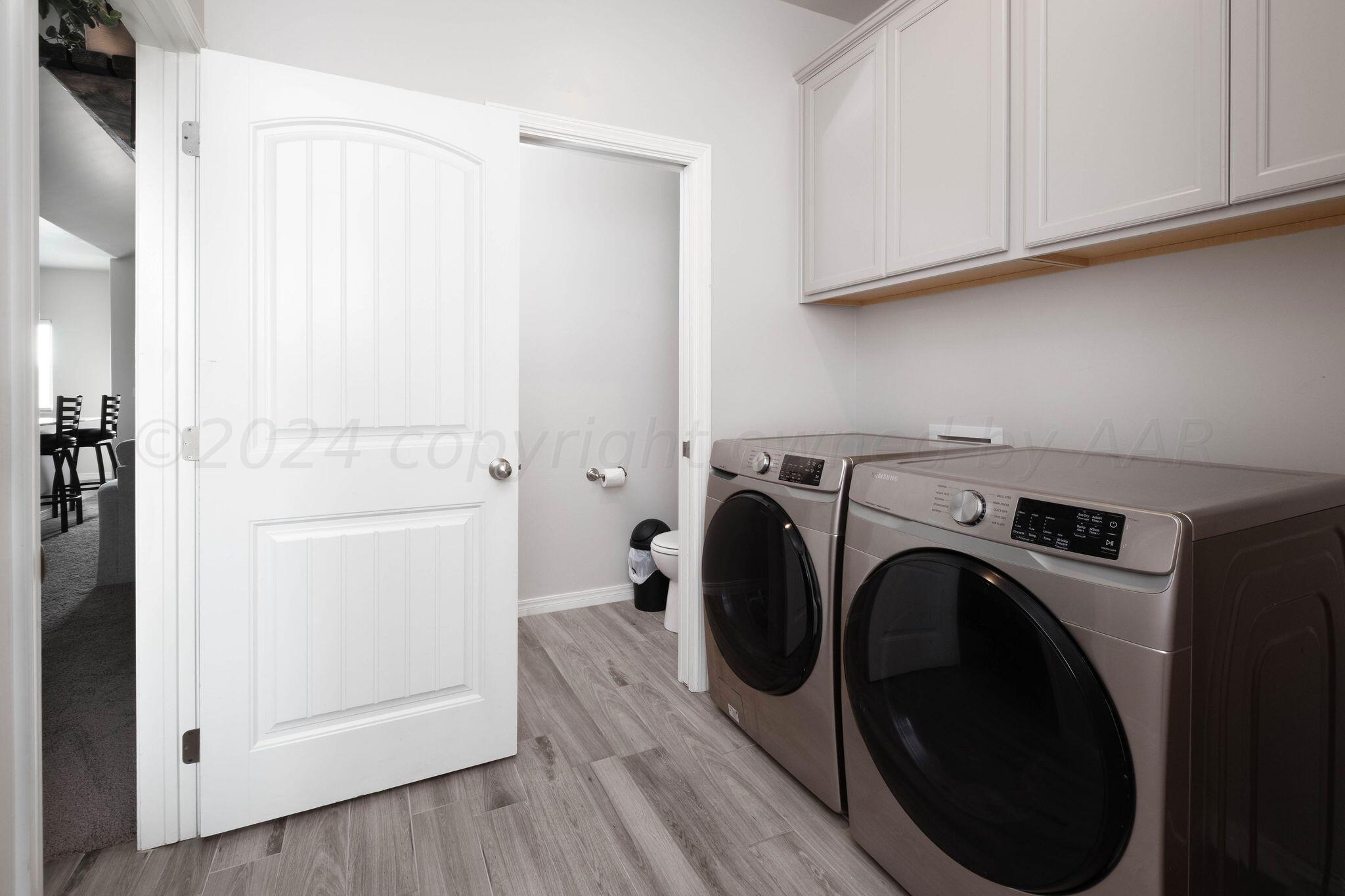 1009 Syrah Boulevard Amarillo, TX 79124 - Photo 31 of 35 a utility room with dryer and washer