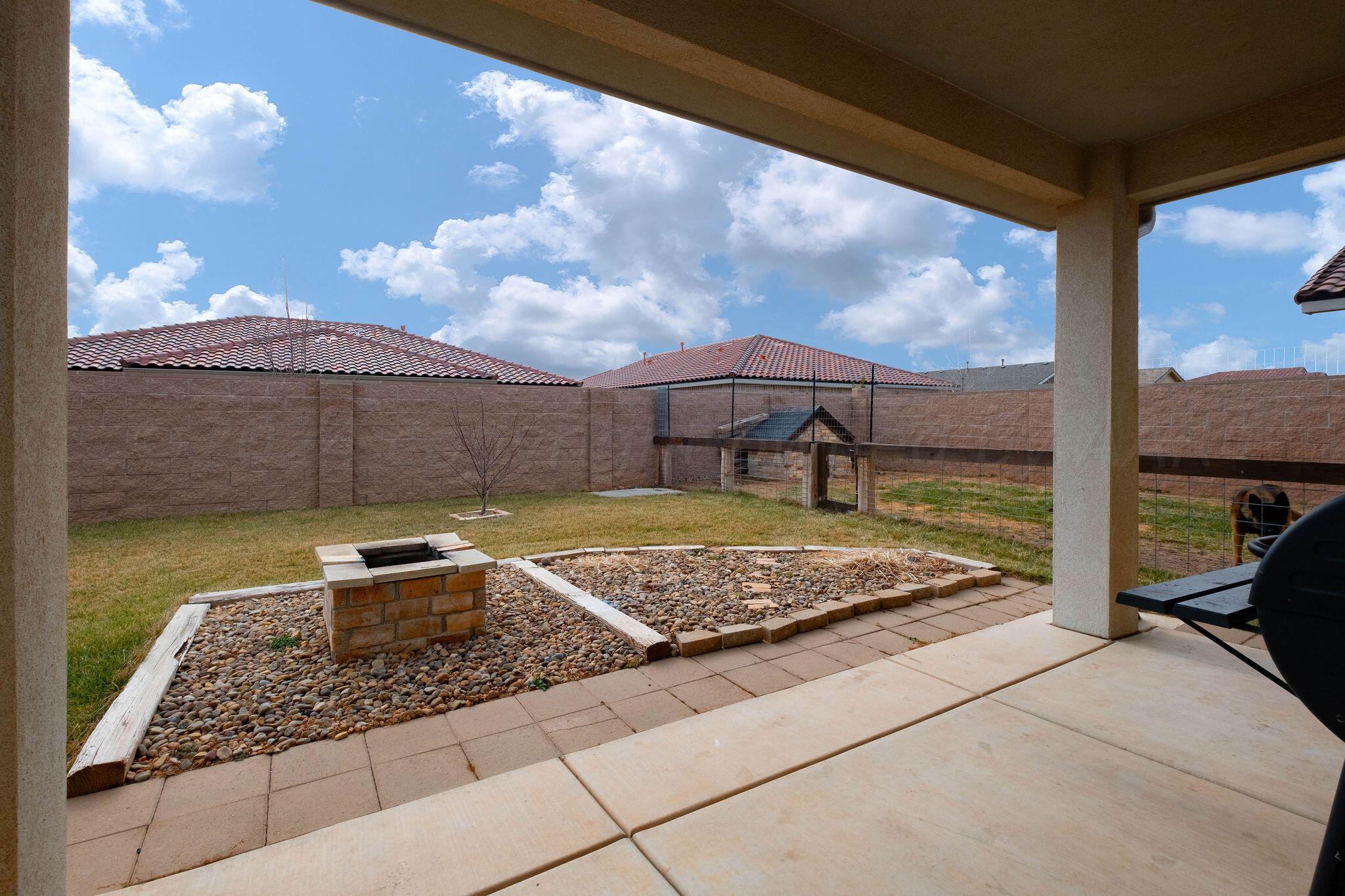 1009 Syrah Boulevard Amarillo, TX 79124 - Photo 33 of 35 a view of a backyard with sitting area