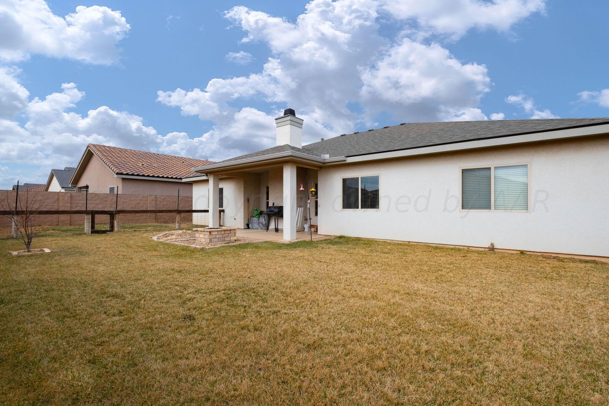 1009 Syrah Boulevard Amarillo, TX 79124 - Photo 35 of 35 a view of a house with backyard and sitting area