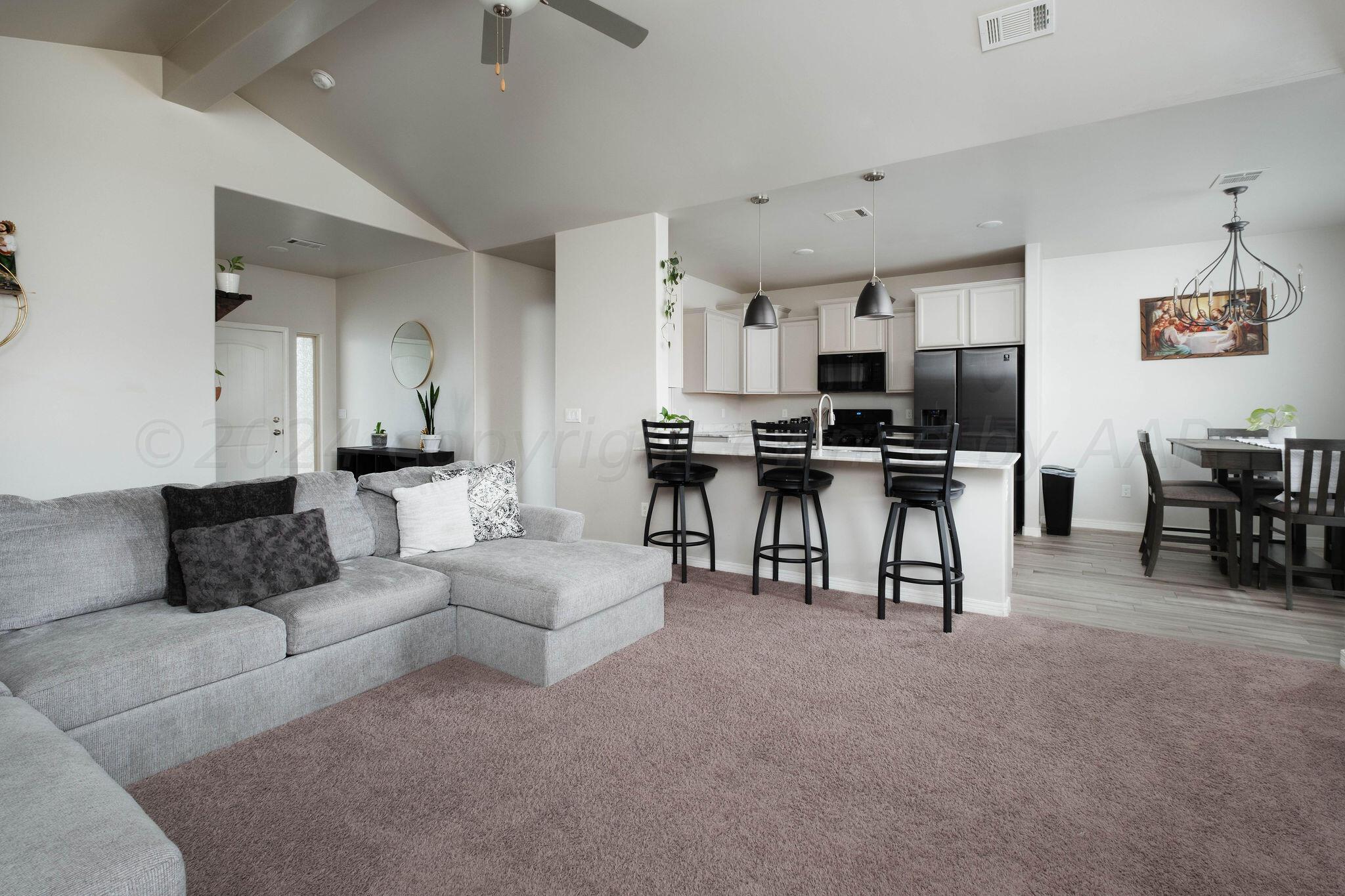 1009 Syrah Boulevard Amarillo, TX 79124 - Photo 7 of 35 a living room with furniture and a piano table