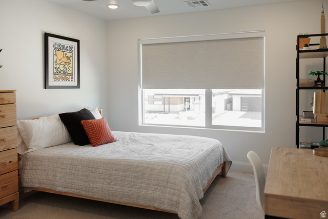 629 Spring Lily Drive St. George, UT 84790 - Photo 32 of 50 Bright room featuring a large window with roller shades, recessed lighting, and a ceiling fan