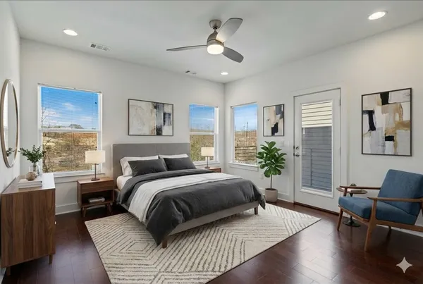 a view of an empty room with a cabinet and a window