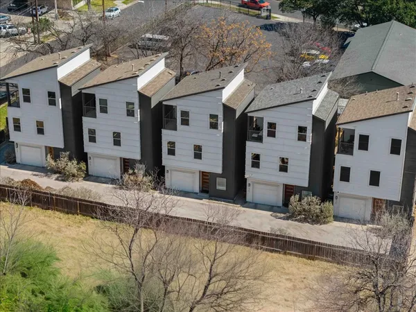 a front view of a houses with yard