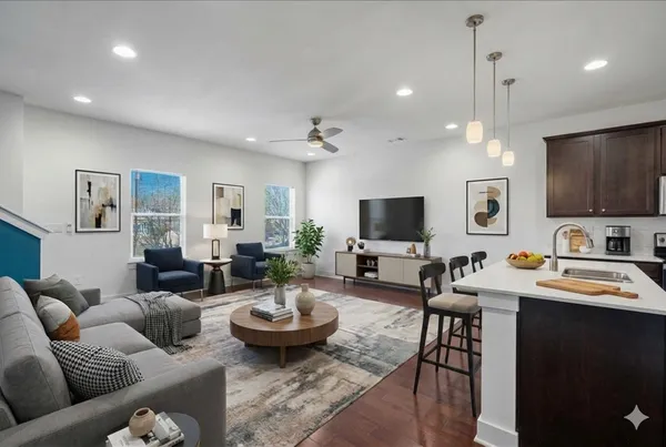 a kitchen with granite countertop a stove and a microwave