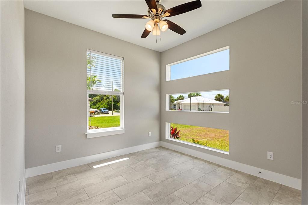 24399 Southwest Kingsway Circle Punta Gorda, FL 33983 - Photo 18 of 38 a view of an empty room with a window