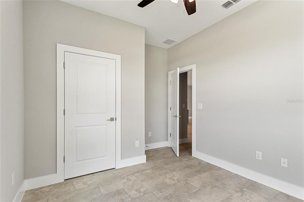 24399 Southwest Kingsway Circle Punta Gorda, FL 33983 - Photo 20 of 38 an empty room with window and closet area