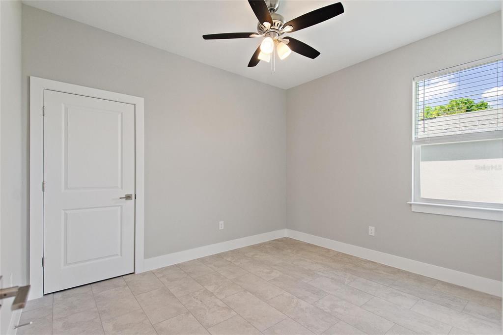 24399 Southwest Kingsway Circle Punta Gorda, FL 33983 - Photo 21 of 38 an empty room with windows and closet