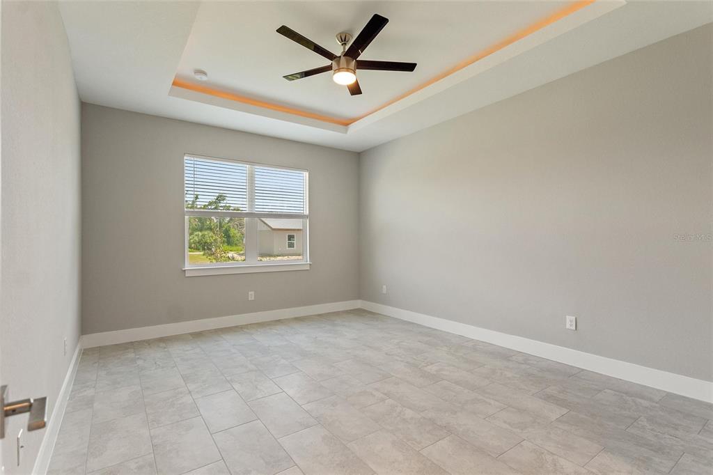 24399 Southwest Kingsway Circle Punta Gorda, FL 33983 - Photo 28 of 38 an empty room with window and windows