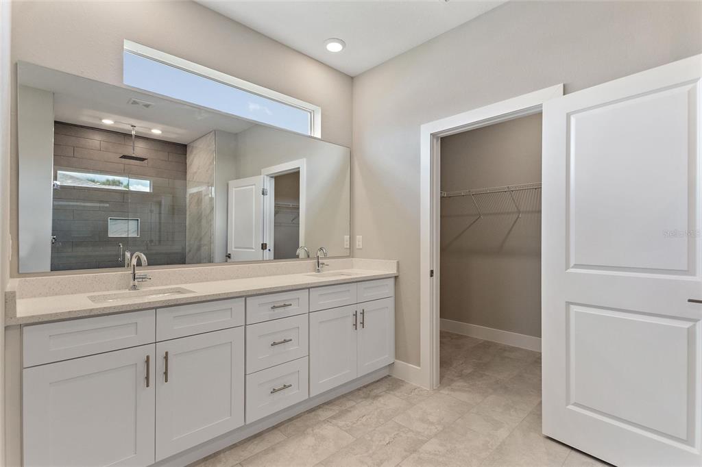 24399 Southwest Kingsway Circle Punta Gorda, FL 33983 - Photo 29 of 38 a bathroom with a granite countertop sink mirror and