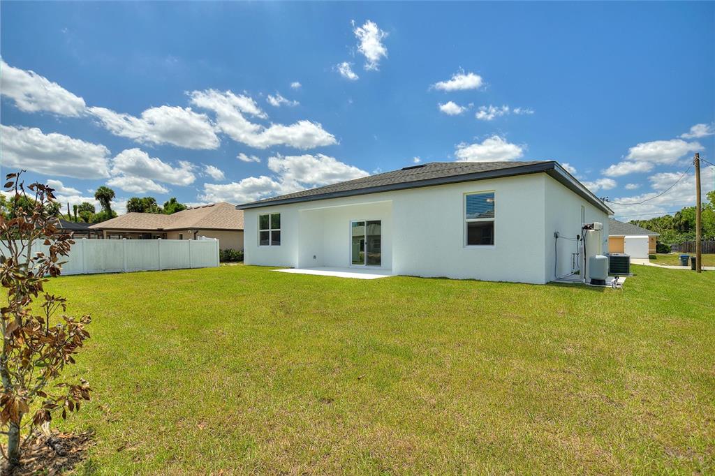 24399 Southwest Kingsway Circle Punta Gorda, FL 33983 - Photo 34 of 38 a view of a house with backyard and garden