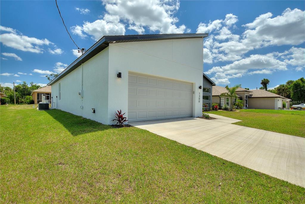 24399 Southwest Kingsway Circle Punta Gorda, FL 33983 - Photo 5 of 38 a view of a backyard of the house