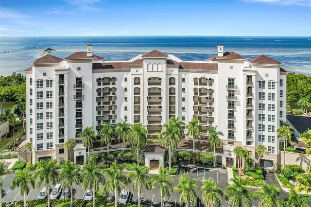 a front view of building with potted plants