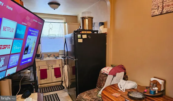 a room with furniture a washer and dryer