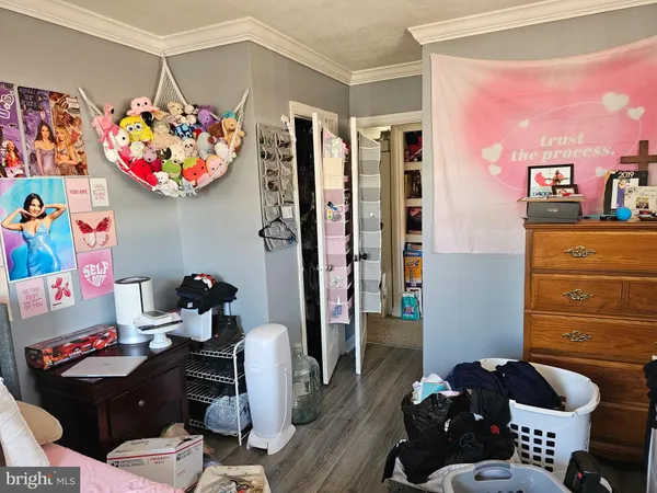 a room that has a couch and a dresser in it