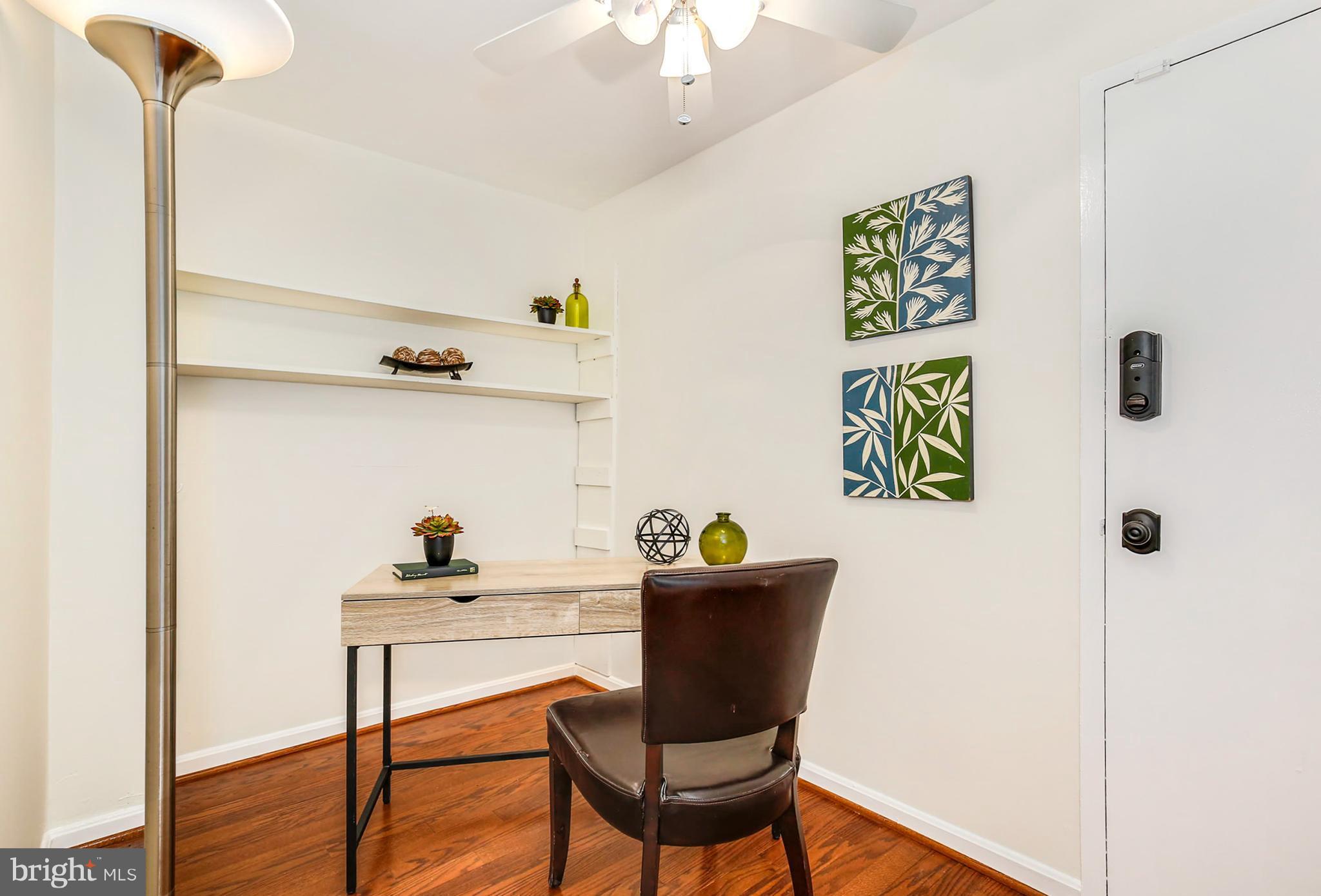 3244 Grace Street Northwest, Unit 3244 Washington, DC 20007 - Photo 14 of 22 a view of a workspace with furniture and wooden floor