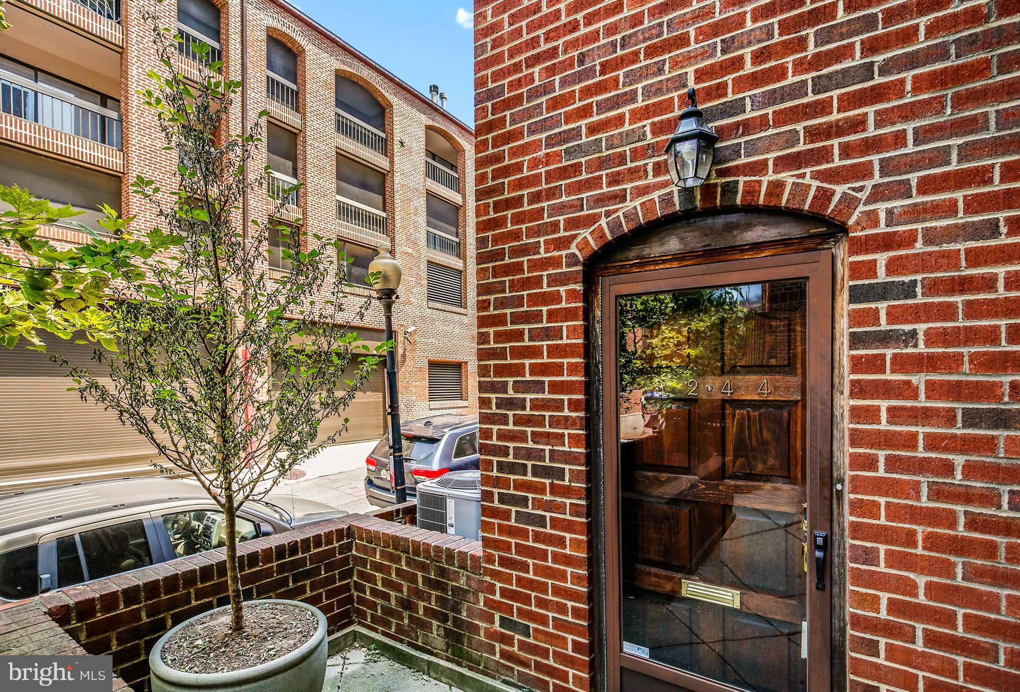 3244 Grace Street Northwest, Unit 3244 Washington, DC 20007 - Photo 3 of 22 a front view of a building with a fountain