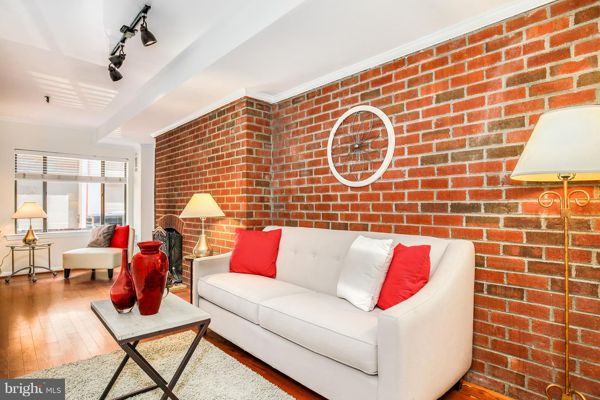 3244 Grace Street Northwest, Unit 3244 Washington, DC 20007 - Photo 8 of 22 a living room with furniture and a flat screen tv