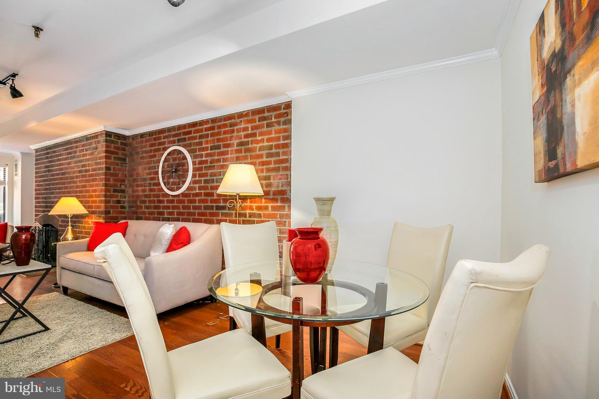3244 Grace Street Northwest, Unit 3244 Washington, DC 20007 - Photo 9 of 22 a living room with furniture and a table