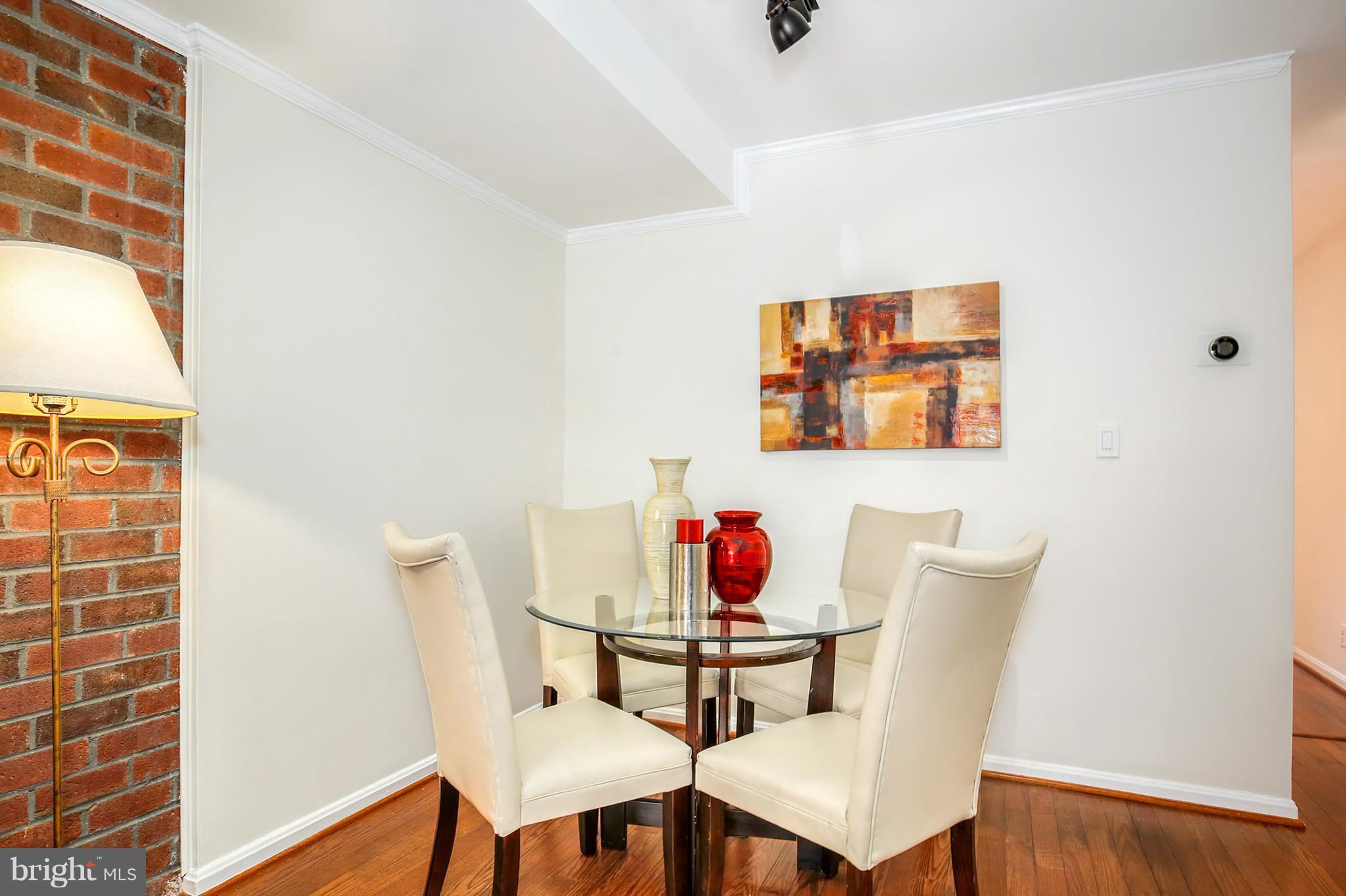 3244 Grace Street Northwest, Unit 3244 Washington, DC 20007 - Photo 10 of 22 a view of a dining room with furniture and wooden floor