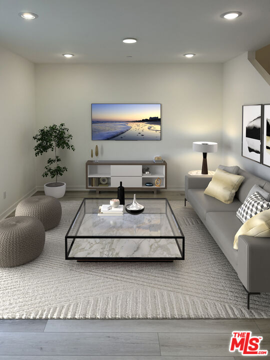 a living room with furniture and a lamp