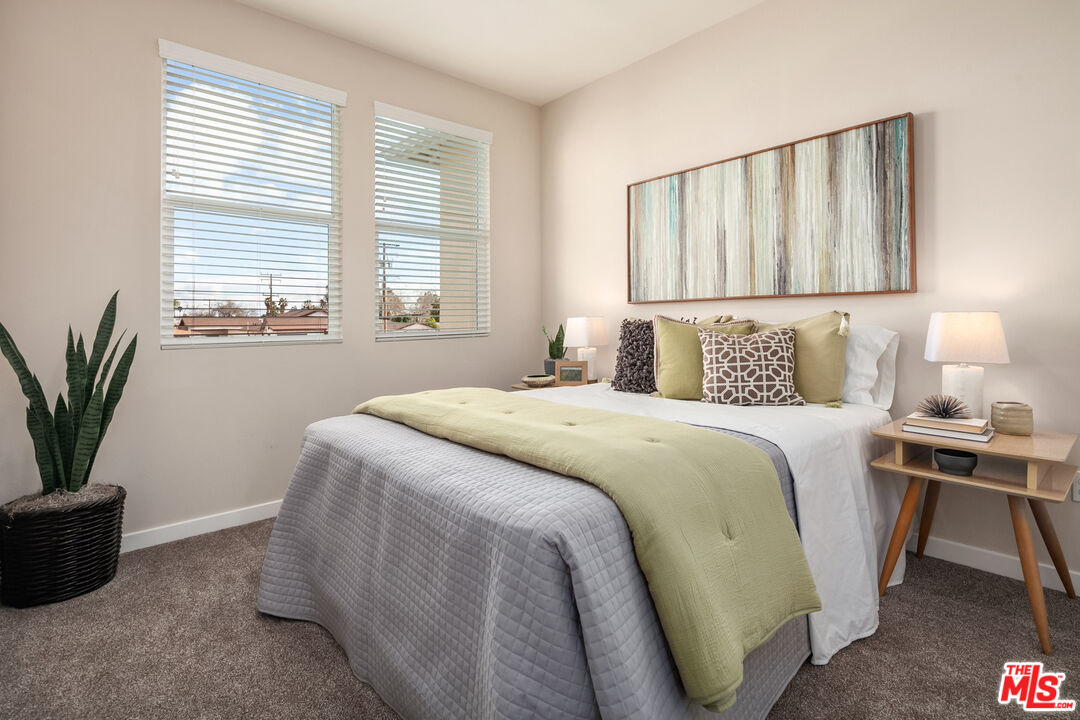 1385 Chervil Way Upland, CA 91786 - Photo 11 of 17 a bedroom with a bed and a window