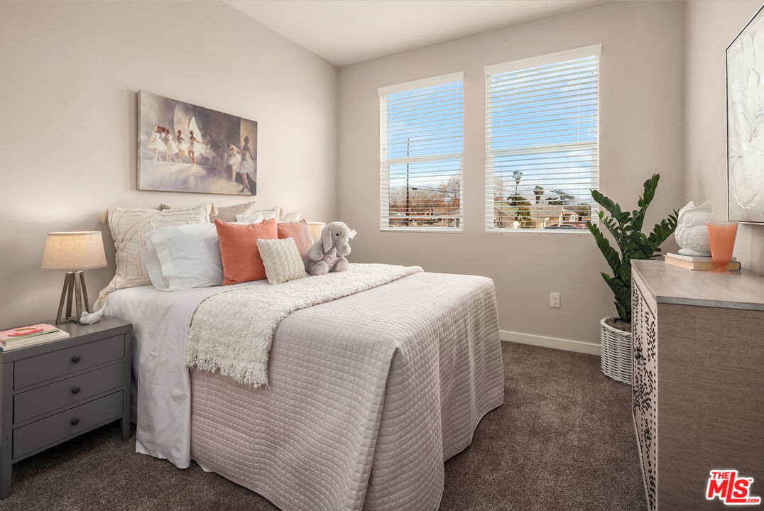 1385 Chervil Way Upland, CA 91786 - Photo 12 of 17 a bedroom with a large bed and a potted plant