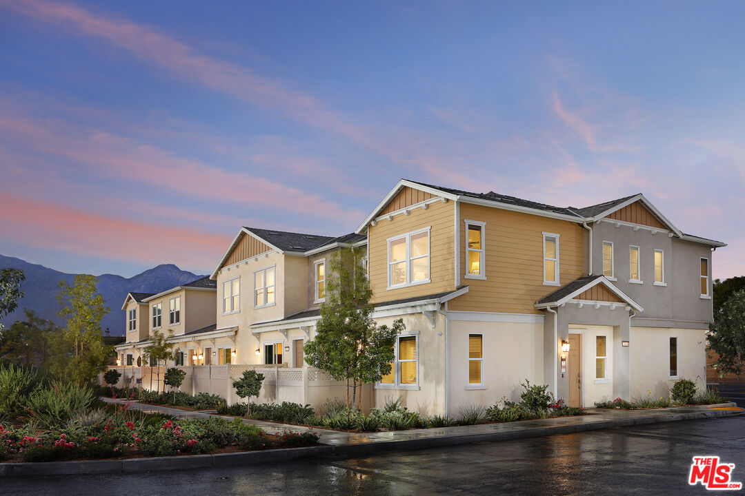 1385 Chervil Way Upland, CA 91786 - Photo 16 of 17 a front view of a house with yard and lake view