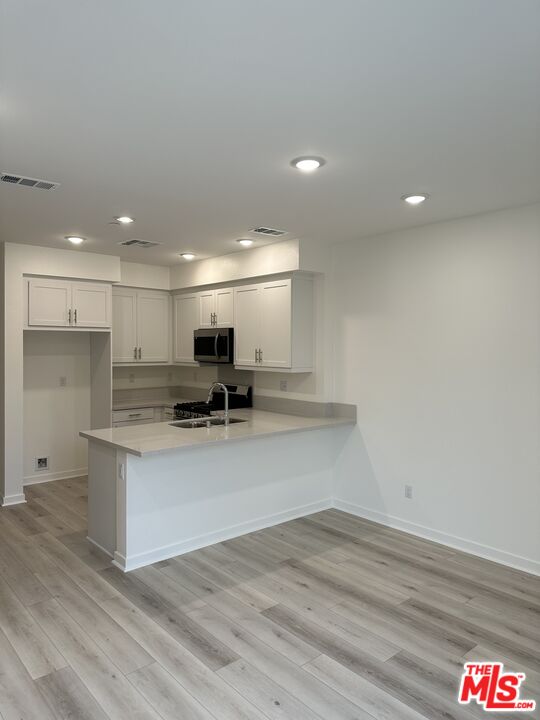 1385 Chervil Way Upland, CA 91786 - Photo 3 of 17 a view of kitchen with wooden floor