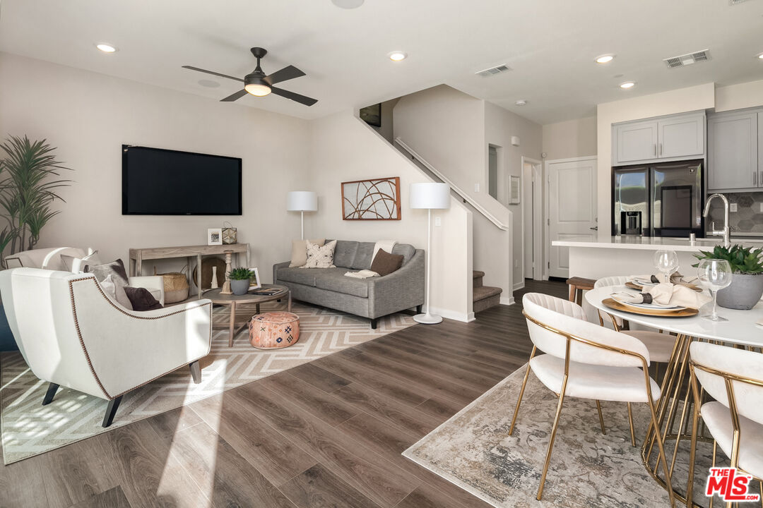 1385 Chervil Way Upland, CA 91786 - Photo 6 of 17 a living room with furniture a flat screen tv and kitchen view