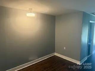 a view of small space with wooden floor