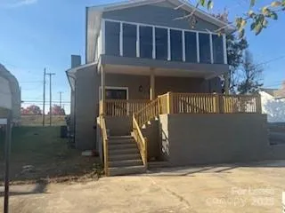 a view of a house with brick walls