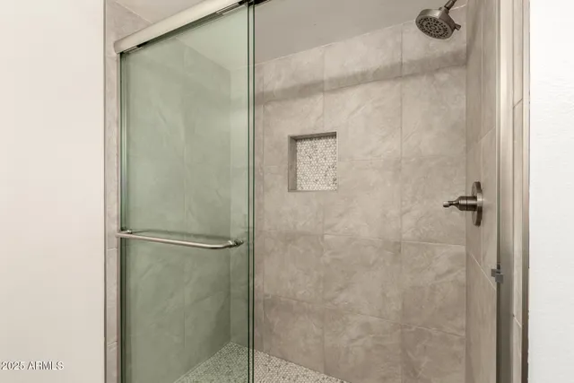 a bathroom with a double vanity sink and mirror