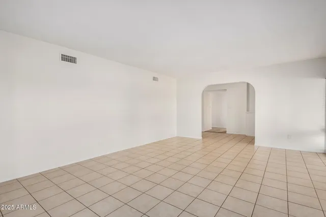 a view of an empty room and window