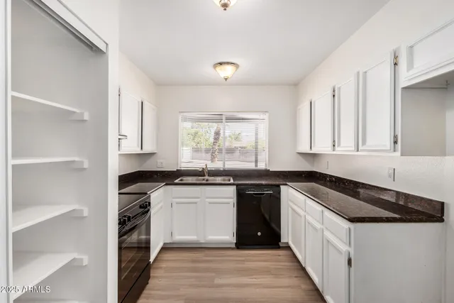 a black and white photo of a living room