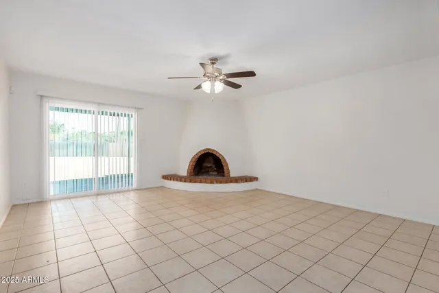 a kitchen with granite countertop a sink a stove and cabinets