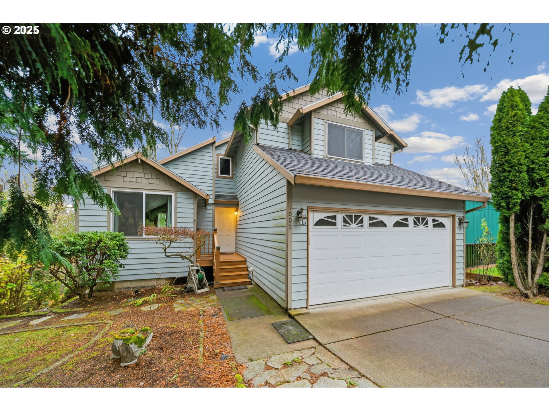 1005 Southwest 4th Street Gresham, OR 97080 - Photo 1 of 40 a view of a house with a yard and plants