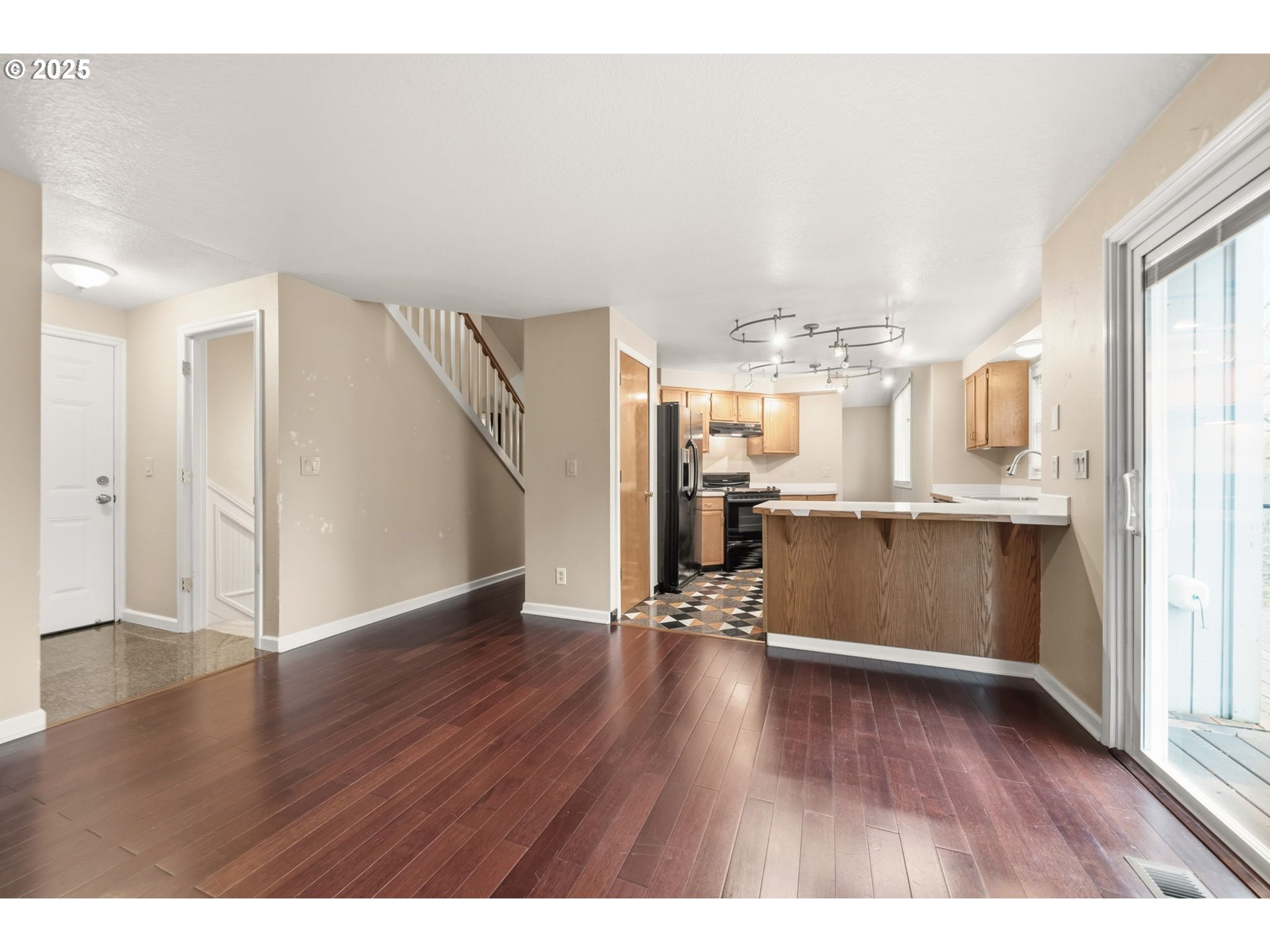 1005 Southwest 4th Street Gresham, OR 97080 - Photo 13 of 40 a view of a kitchen with wooden floor