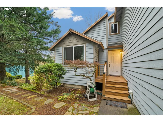 a view of a house with a yard and wooden floor