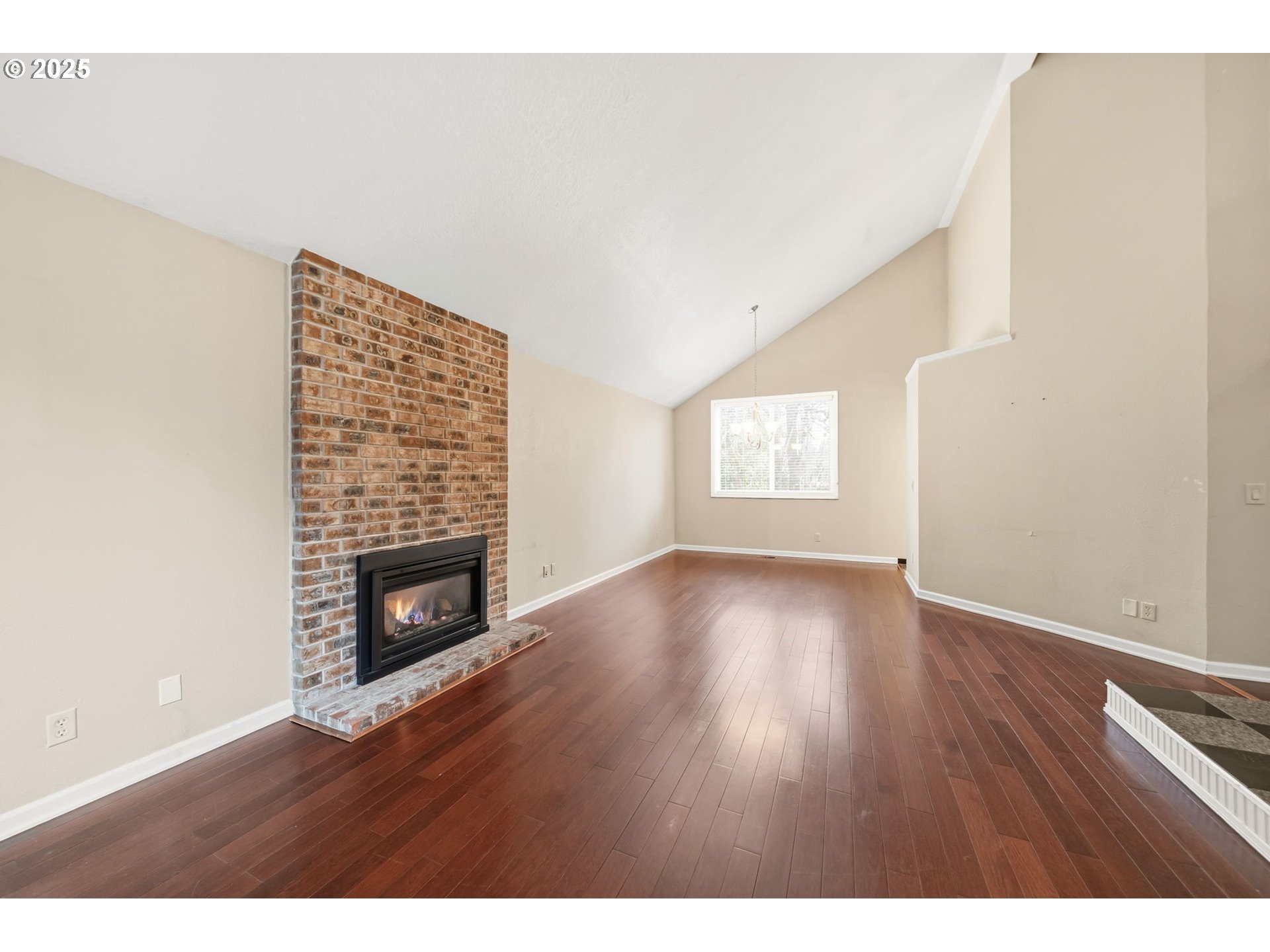 1005 Southwest 4th Street Gresham, OR 97080 - Photo 8 of 40 a view of an empty room with a fireplace and a window
