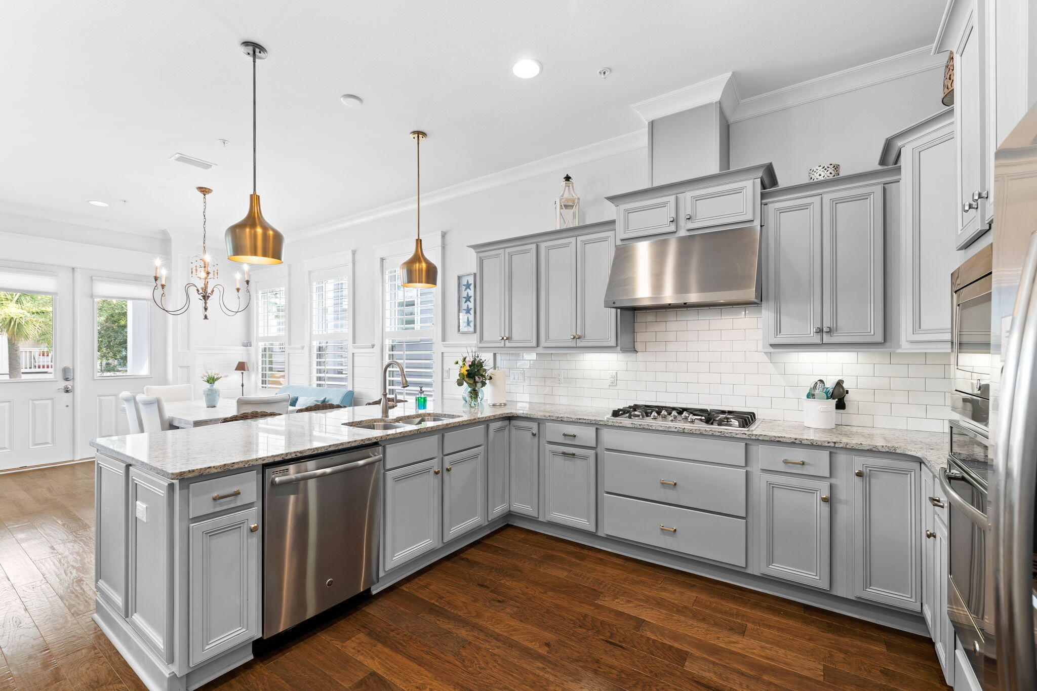 108 Gulfview Way Santa Rosa Beach, FL 32459 - Photo 16 of 51 a kitchen with stainless steel appliances granite countertop a sink a stove and white cabinets