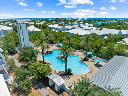 an aerial view of a house with yard swimming pool and outdoor seating