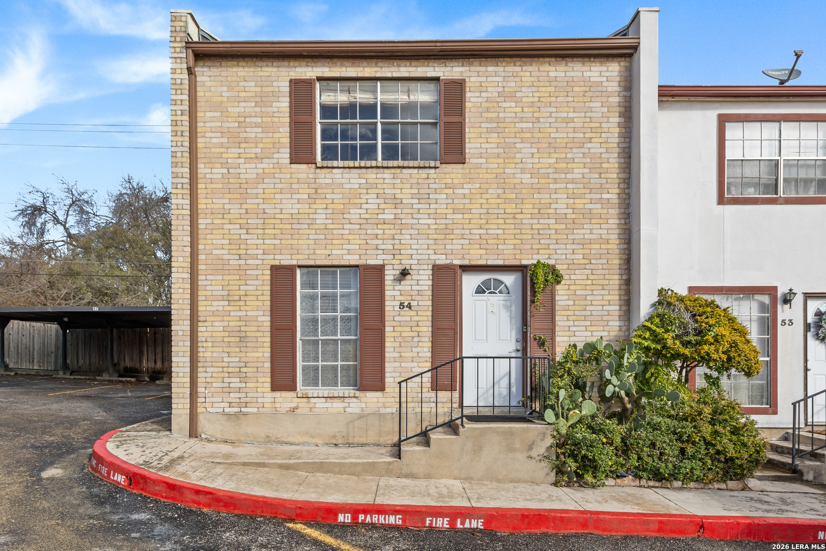 6427 Wurzbach Road, Unit 54 San Antonio, TX 78240 - Photo 11 of 18 a front view of a house with a porch