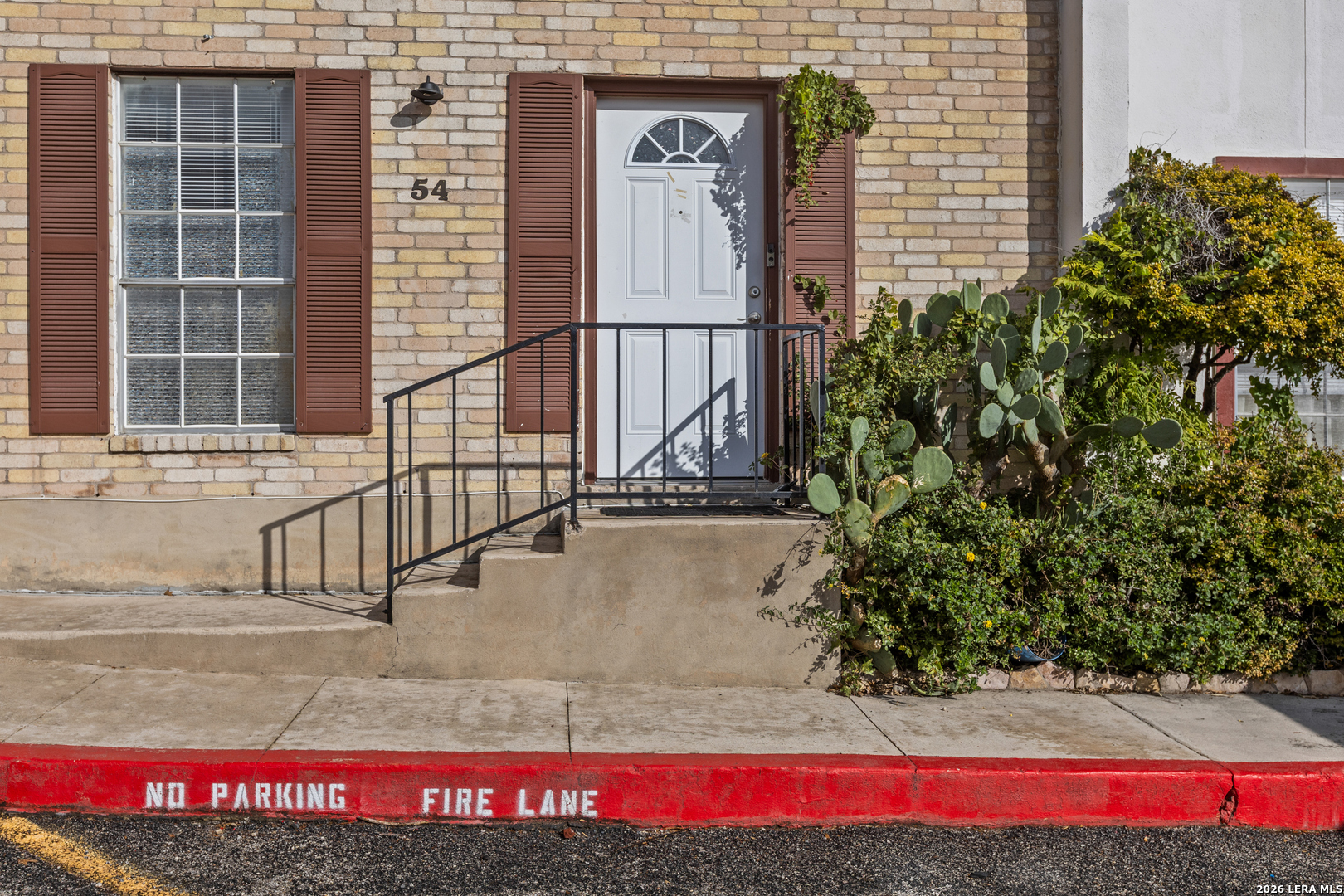 6427 Wurzbach Road, Unit 54 San Antonio, TX 78240 - Photo 14 of 18 a view of a brick house with a street