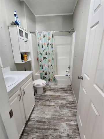 a workspace with furniture a rug and a large window