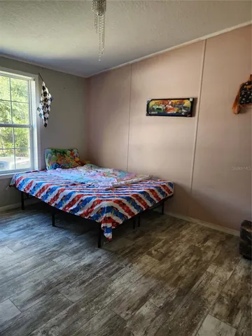 a room with furniture and a flat screen tv