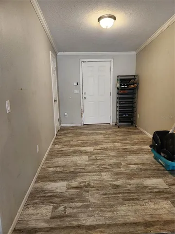 a view of an empty room with stairs